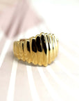 Front view of Pigalle Ring in Yellow Gold – A modern and bold statement ring with a textured surface.