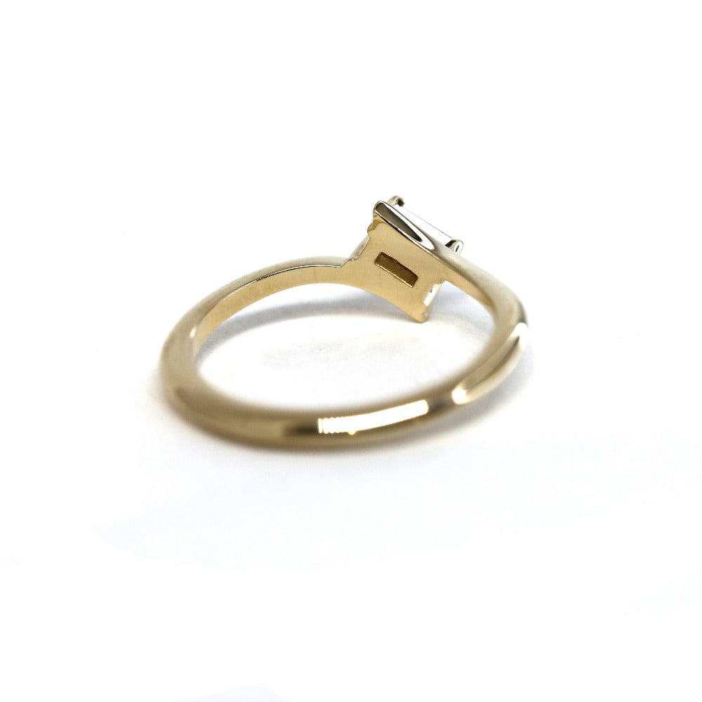 Back view of a yellow gold Kink Baguette Chocolat Diamond Ring with a baguette-cut brown diamond crafted by Bena Jewelry photographed on a white background bespoke jewelry from Montreal.