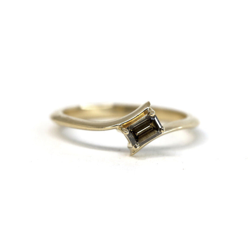 Kink Baguette Chocolat Diamond Ring in yellow gold featuring a baguette-cut chocolate diamond by Bena Jewelry photographed on a white background custom-made in Montreal.