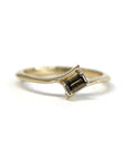 Kink Baguette Chocolat Diamond Ring in yellow gold featuring a baguette-cut chocolate diamond by Bena Jewelry photographed on a white background custom-made in Montreal.