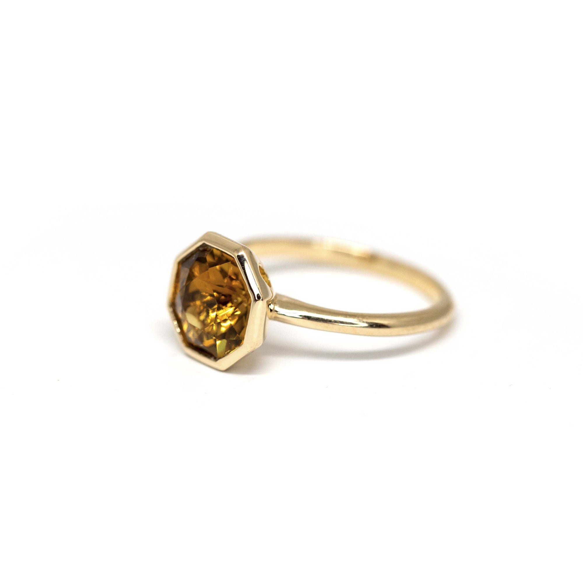 Side view of Fireball Citrine ring – Radiant hexagonal citrine gemstone with a warm glow, encased in solid yellow gold. A striking cocktail ring by Bena Jewelry.