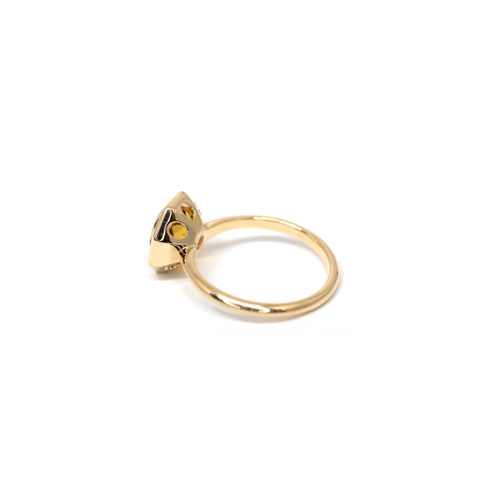 Angled shot of Fireball Citrine ring – Modern and edgy design featuring a faceted Brazilian citrine in a sleek bezel setting. Handmade in Canada by Bena Jewelry.