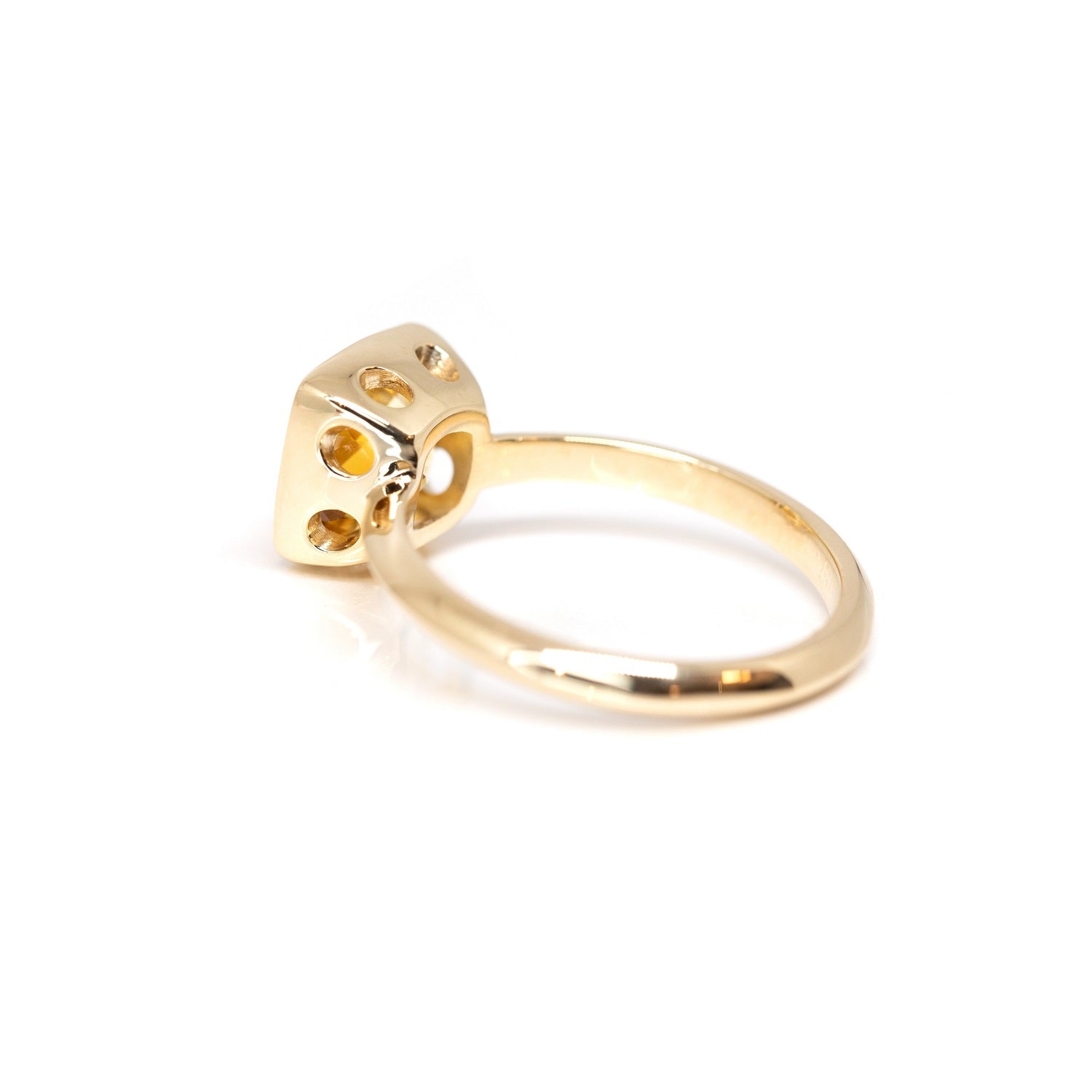 Back view of the Bezel Set Citrine ring, crafted by Bena Jewelry in Montreal, Canada, emphasizing the smooth yellow gold band and the natural Brazilian citrine's warm yellow-orange hue, reflecting modern fine jewelry design.