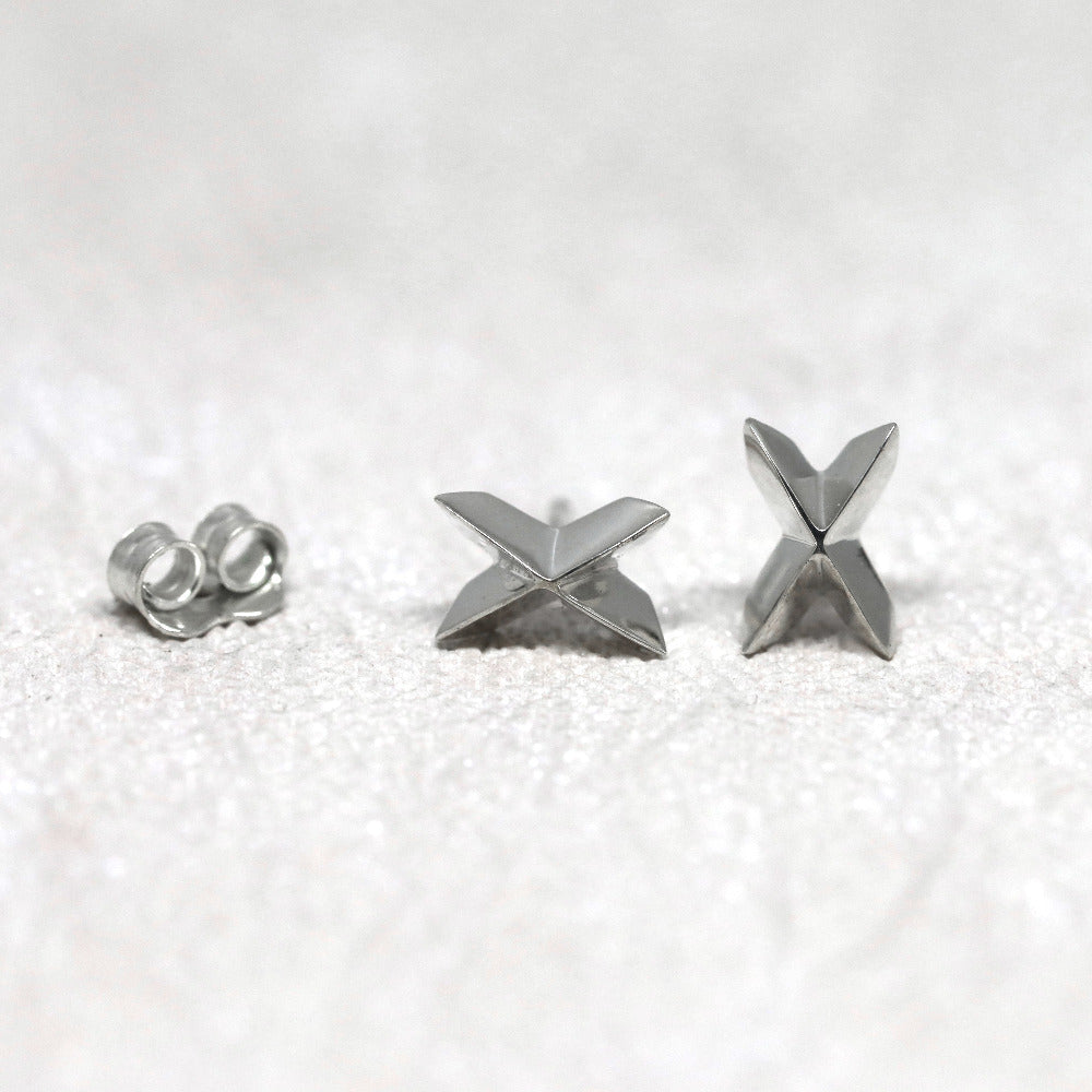 White gold Cross Gold Studs with bold geometric styling by Bena Jewelry, displayed on a light-colored background, unique unisex fine jewelry made in Canada.