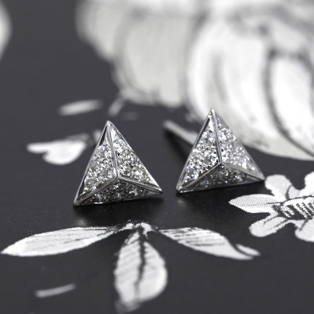 Dark background for Delta diamond and white gold stud earrings from Fancy Edgy Collection by Bena Jewerly Designer. Montreal Made, Canadian fine jewelry.