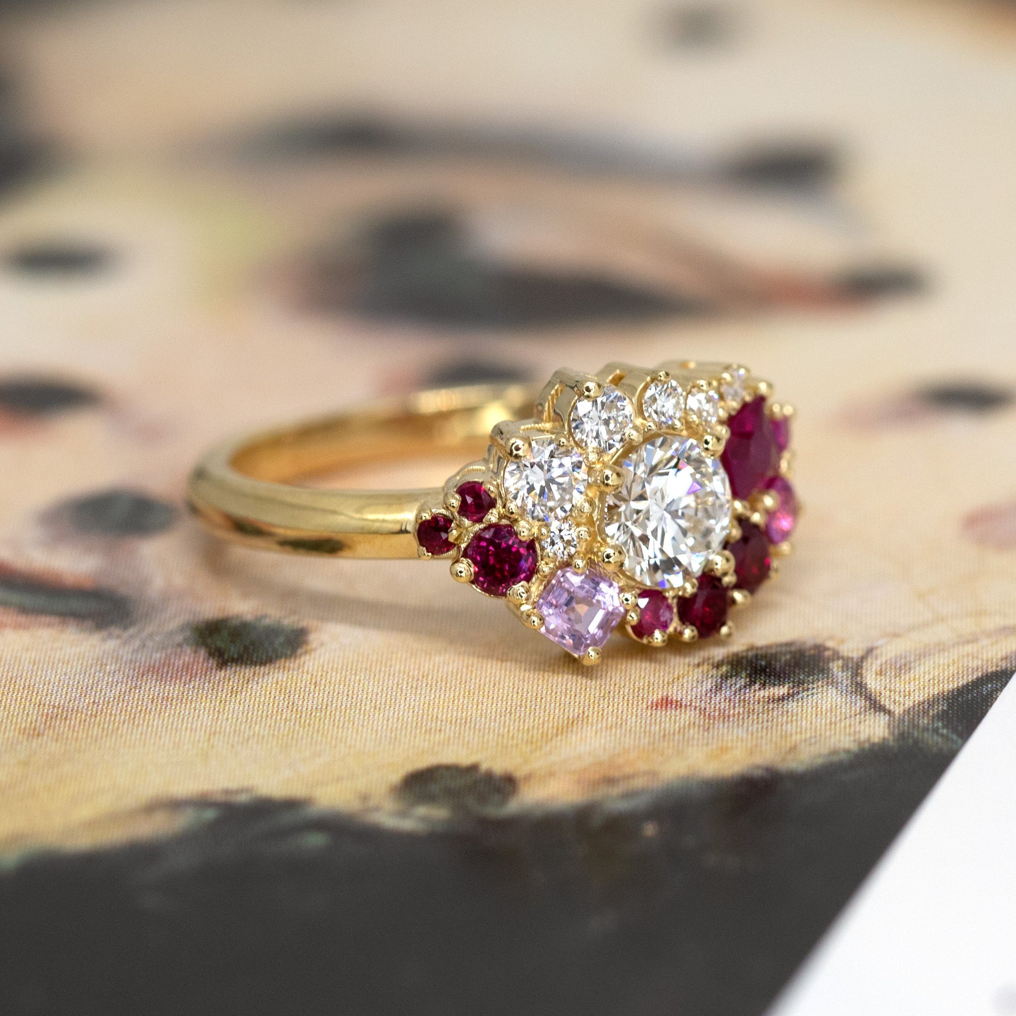 Displays the cohesive arrangement of gemstones, blending modern shapes with traditional craftsmanship. Designed in Montreal by Bena Jewelry.