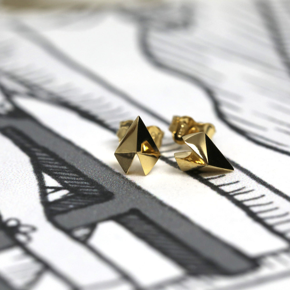 Edgy Gold Heart Studs in white gold by Bena Jewelry, showcasing a modern geometric heart design, photographed on a white background, fine unisex jewelry made in Montreal.