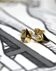 Edgy Gold Heart Studs in white gold by Bena Jewelry, showcasing a modern geometric heart design, photographed on a white background, fine unisex jewelry made in Montreal.