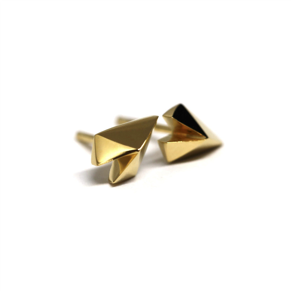 Unique heart-shaped earrings in yellow gold crafted by Bena Jewelry photographed on a plain white background edgy fine jewelry