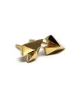 Unique heart-shaped earrings in yellow gold crafted by Bena Jewelry photographed on a plain white background edgy fine jewelry