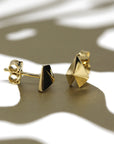 Yellow gold Edgy Gold Heart Studs by Bena Jewelry displayed on a black matte background contemporary designer earrings made in Canada