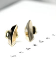 Bold and modern Brace Studs in yellow gold, crafted by Bena Jewelry, an independent designer from Montreal.