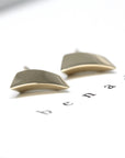 Contemporary unisex earrings made of yellow gold, showcasing a volumetric design and Montreal-based craftsmanship.