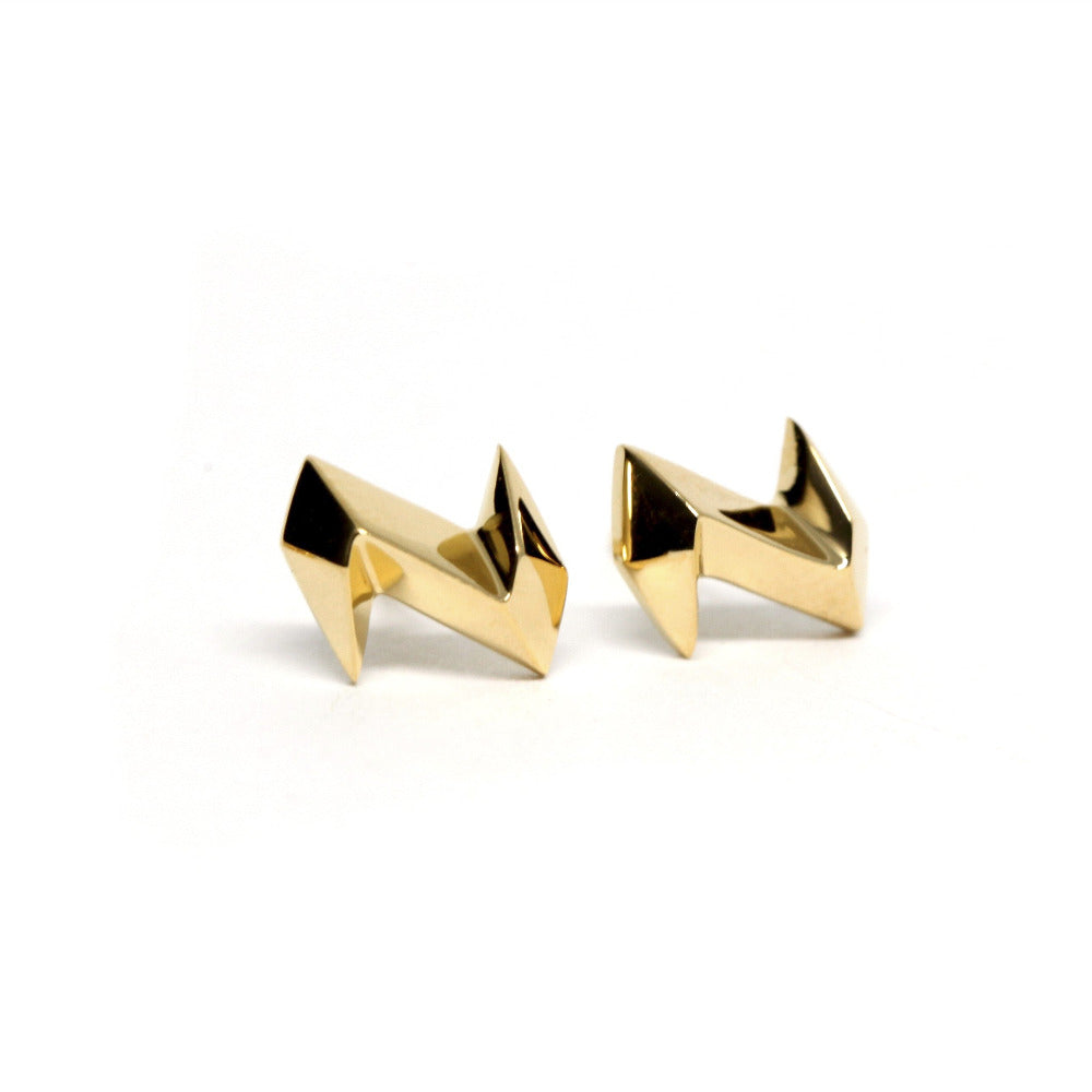 Side view of edgy gold studs – Small yet statement-worthy, these solid gold earrings have a sleek and modern finish.