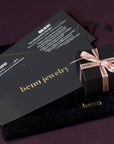 Blade stud earrings in white gold by Bena Jewelry, showcased in a sleek black jewelry box with velvet lining. This luxurious presentation enhances the modern and edgy design, crafted in Montreal and handmade in Canada.