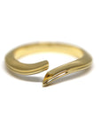 Kink Ring in Yellow Gold on white background – A modern and sculptural open gold ring with a sleek, edgy design, handcrafted by Bena Jewelry in Montreal.