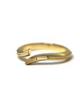 Close-up of Kink Ring in Yellow Gold – A minimalist statement ring with a fluid open-ended structure and high-polish finish.