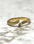 Side view of Kink Ring in Yellow Gold – A contemporary unisex fine jewelry piece with a dynamic, asymmetric silhouette.