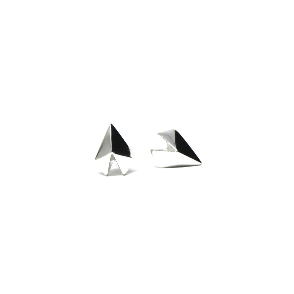White gold heart-shaped stud earrings with a bold design, Edgy Gold Heart Studs by Bena Jewelry, displayed on a white background, custom fine jewelry crafted in Canada.