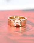 Elegant engagement ring in yellow gold with a large emerald-cut diamond, showcasing a bold and minimalist design. Made in Montreal by Bena Jewelry.
