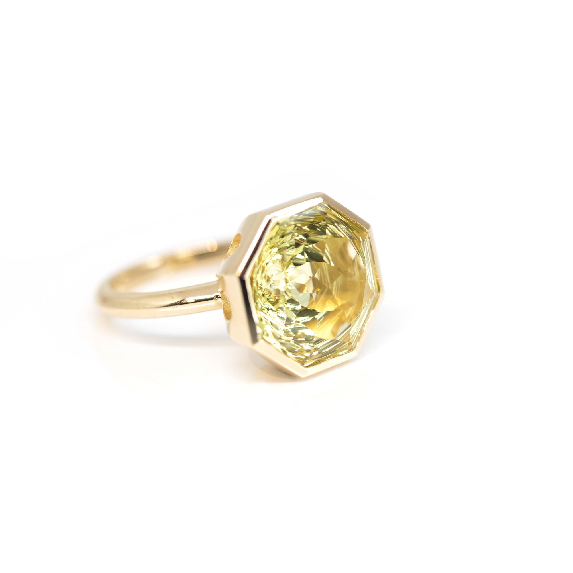 Bold yellow gold cocktail ring with an octagon-cut lemon quartz, handcrafted by Bena Jewelry, displayed on a clean white background.