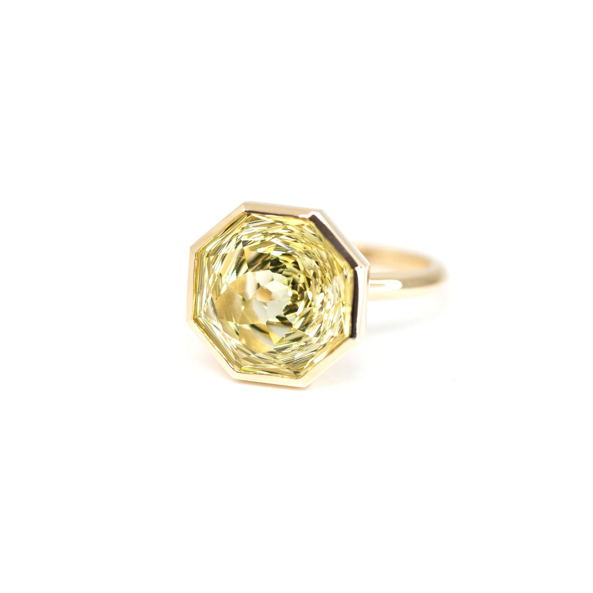Unique lemon quartz statement ring in yellow gold by Bena Jewelry, photographed on a white background, fine jewelry custom-made in Montreal.