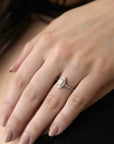 girl with a black shirt wearing a marquise shape yellow diamond bena jewelry custom made engagement ring white gold ring with a yellow color natural gia certified diamond custom made color gems ring little italy montreal fine jewelry designer