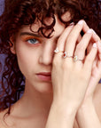 Girl wearing Bena Jewelry colored gemstone engagement ring. Fine jewellery custom made in Montreal, Canada.