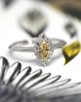 Yellow diamond marquise shape diamond ring small white round diamond custom engagement ring montreal made in canada fine jewelry bena jewelry edgy bridal ring designer color gemstone speicalist montreal made in canada fine jewelry