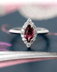 Front view of edgy marquise red gemstone bridal white gold marquise shape gold ring bena jewelry montreal custom made birdal jewelry small white diamonds custom made little italy fine jewelry designer natural rhodolite garnet gems