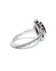 Back view of bena jewelry white gold ring with small diamond and marquise shape red gemstone garnet red rhodolite engegagement ring custom made in montreal fine jewelry designer montreal