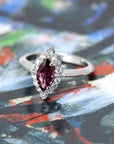 Top view of edgy marquise red gemstone ring bena jewelry montreal white gold small diamonds red natural gemstone custom made in montreal little italy jeweler handemade in montreal canada