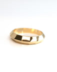 front view of men gold edgy custom made ring in montreal chiseled collection by bena jewely designer in collaboration with boutique ruby mardi best jeweler in canada on white background