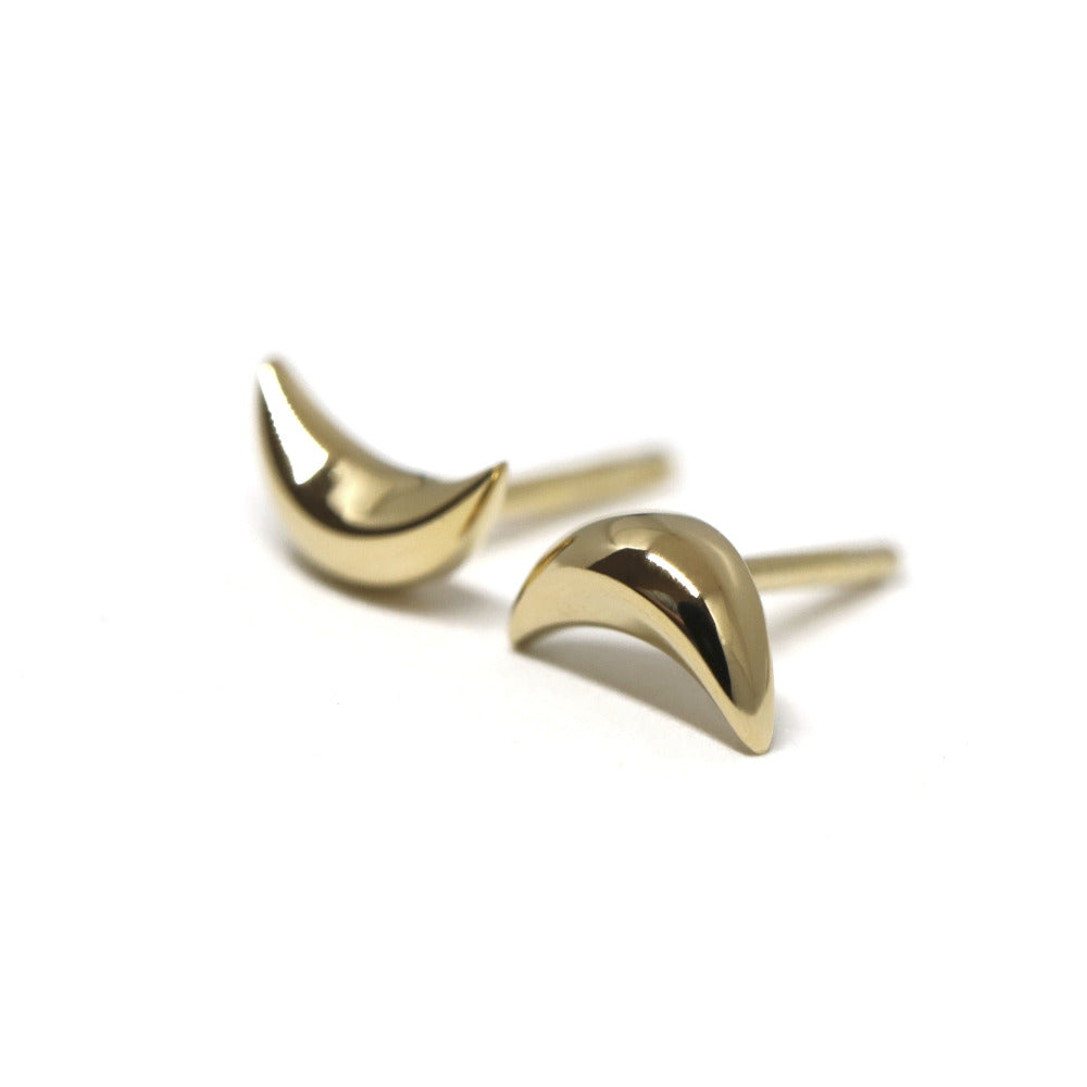 Crescent moon stud earrings in yellow gold by Bena Jewelry, minimalist unisex design, displayed on a white background. Handmade in Canada.