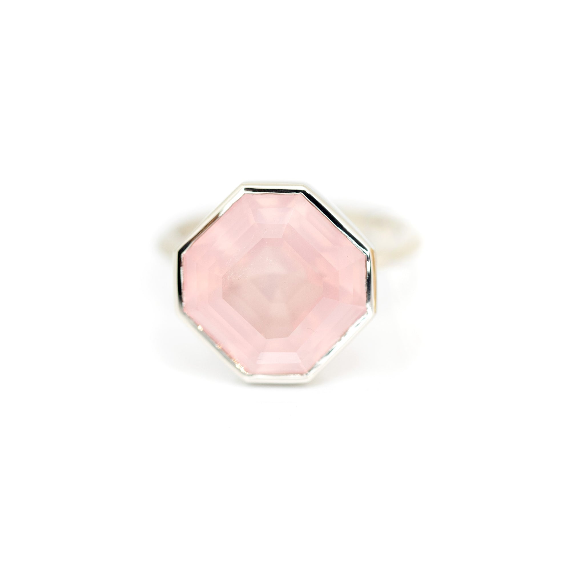 Octagon Rose Quartz Ring in white gold by Bena Jewelry featuring a bezel-set pink translucent rose quartz, photographed on a white background, custom-made in Montreal.