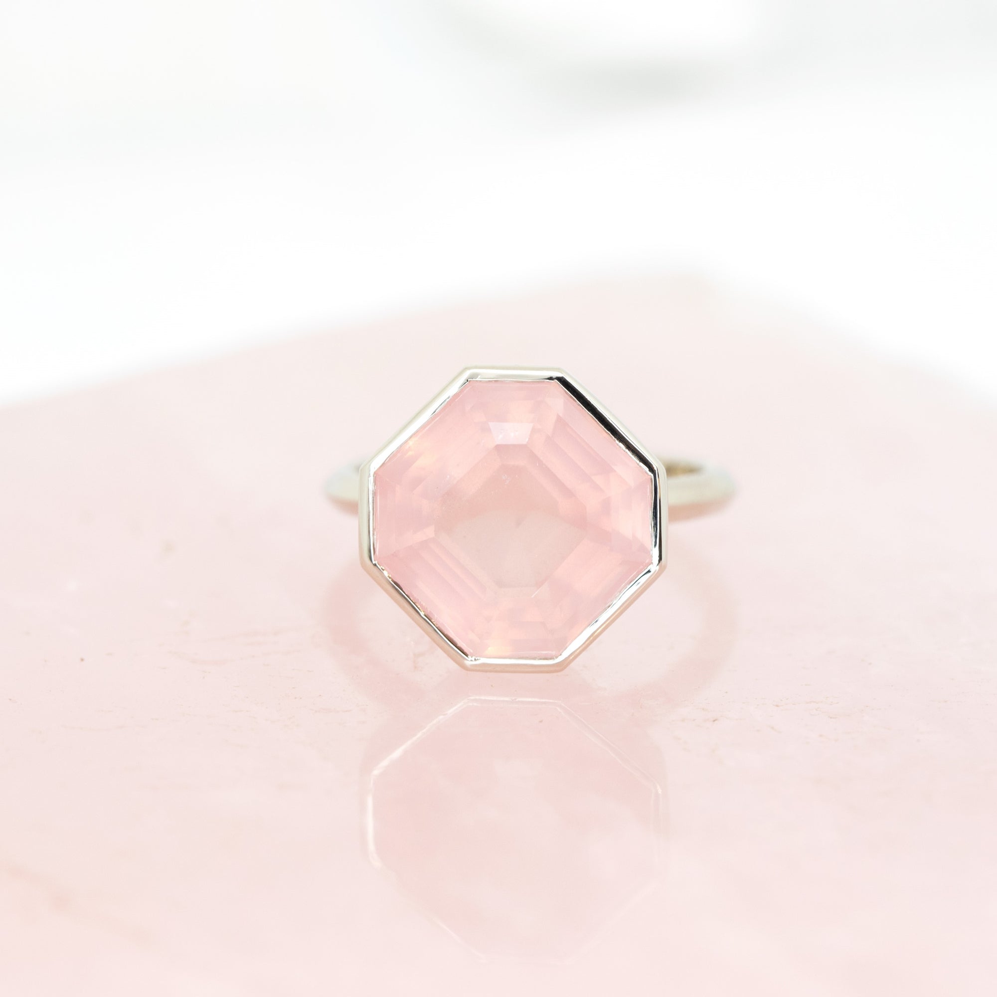 Bold statement ring with an octagon-cut rose quartz in white gold, designed by Bena Jewelry, showcasing modern elegance and natural gemstones.