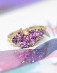 The Avalanche Pink Sapphire Ring paired with complementary pink gemstone jewelry, showcasing its elegance. Made in Montreal, Canada, by Bena Jewelry.