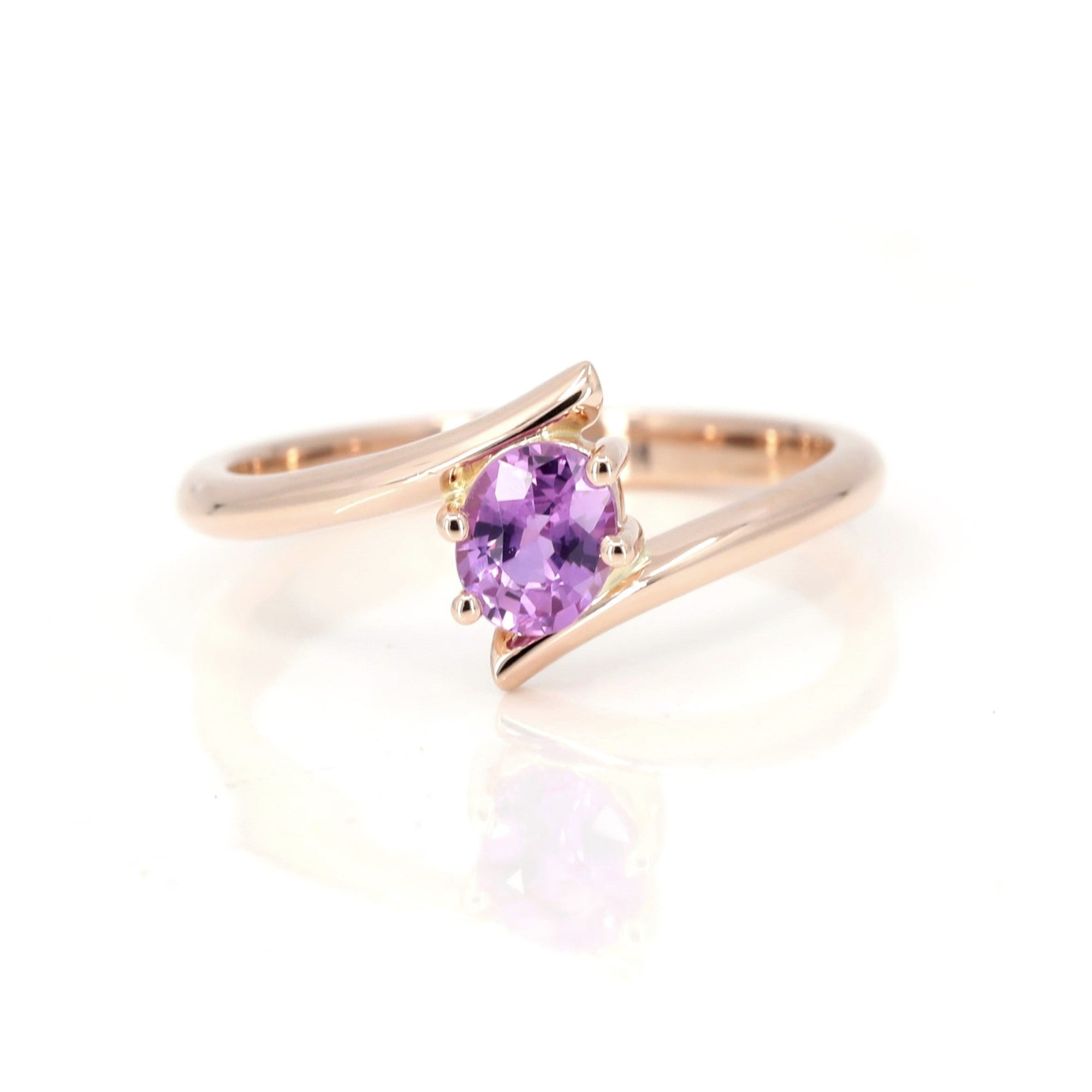 pink sapphire rose gold twist kink ring custom made in montreal by bena jewelry designer on white background