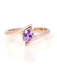 pink sapphire rose gold twist kink ring custom made in montreal by bena jewelry designer on white background