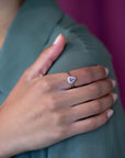 Aura sapphire and diamond ring worn on a woman's hand, highlighting its elegant proportions and refined white gold setting.