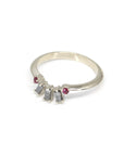 top view of white gold wedding band with salt and pepped diamond round ruby designer ring by bena jewelry on a white background