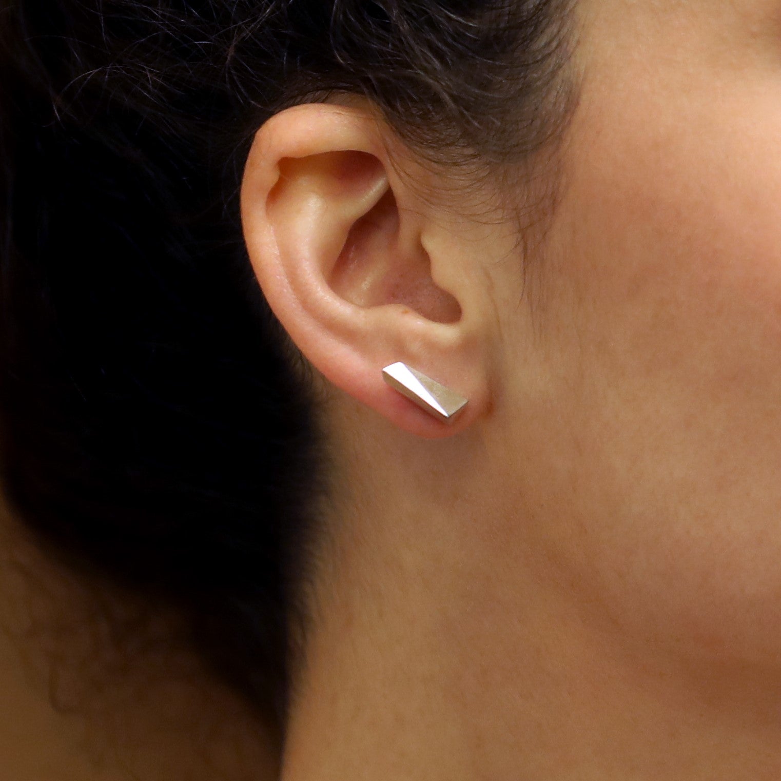 Lifestyle shot of Pike Earrings worn – A refined statement earring that combines minimalism with an edgy aesthetic.