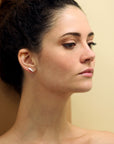 White Gold Pike Earrings worn on ear, close-up – Bold and modern white gold earrings designed for a sleek, contemporary look. Handmade by Bena Jewelry in Montreal.