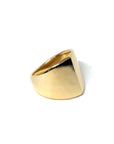 Boxy Gold Ring on soft-toned background – The sleek edges and high-polish gold contrast beautifully, enhancing the minimalist design.
