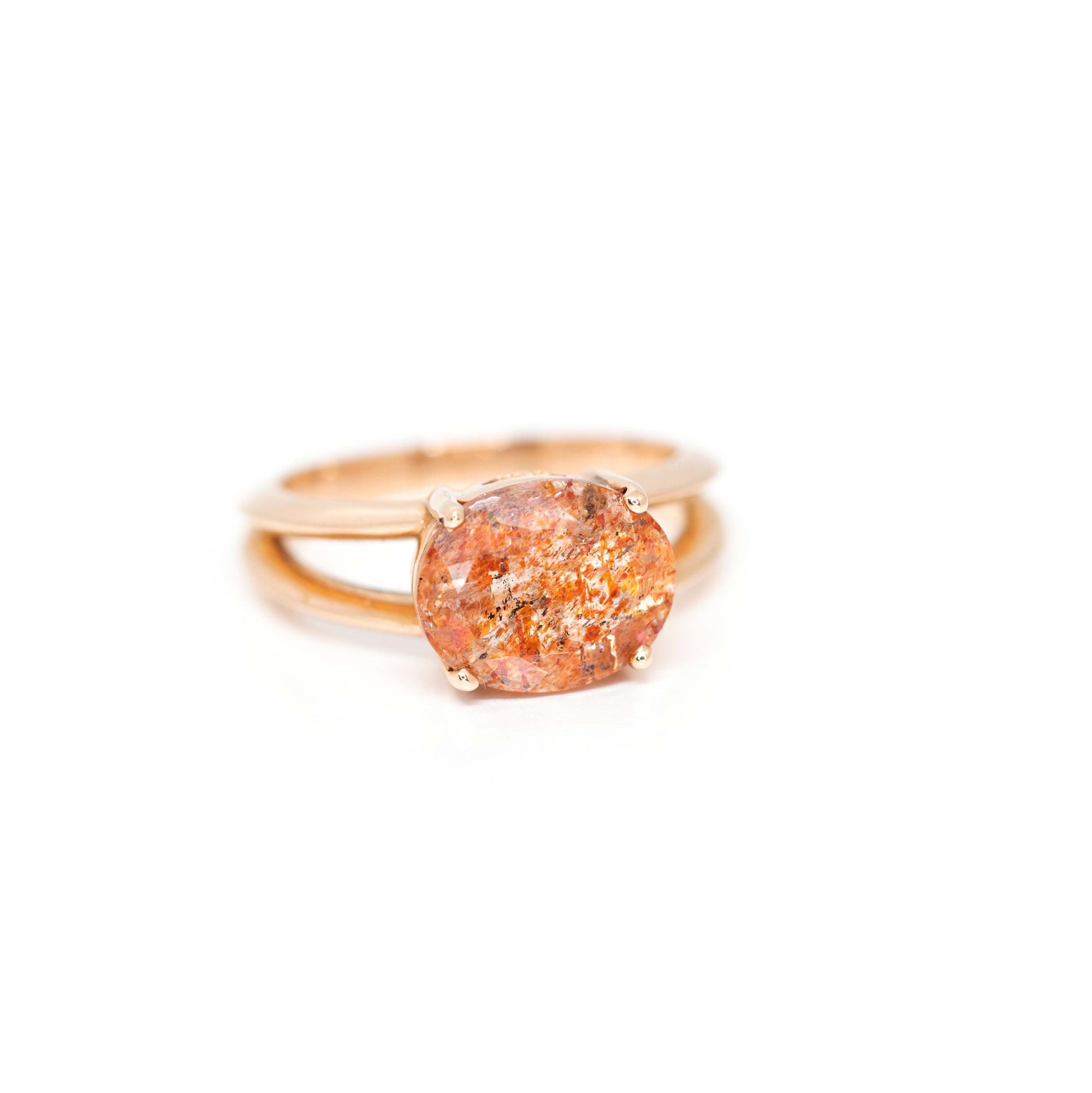 Bena Jewelry present close-up of a natural oval sunstone set in rose gold, handcrafted fine jewelry from Montreal.