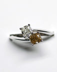 Close-up of diamond ring – A modern engagement ring with two natural diamonds, symbolizing unity and love.