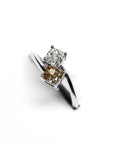 Side view of Toi et Moi ring – A timeless fine jewelry piece featuring an elegant contrast between white and brown diamonds.