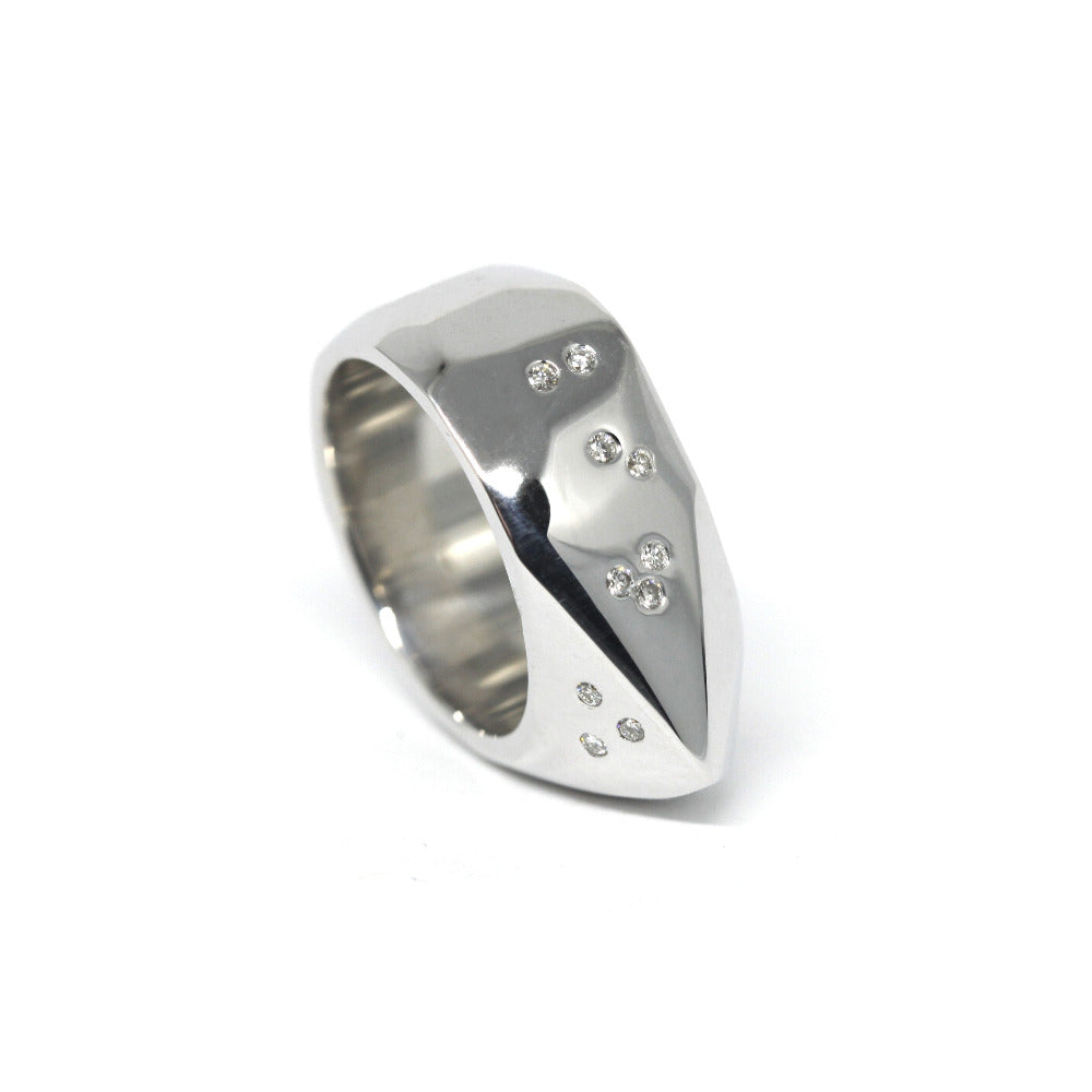 Side view of silver ring – A contemporary handcrafted ring with an artisanal finish and modern scattered diamonds.