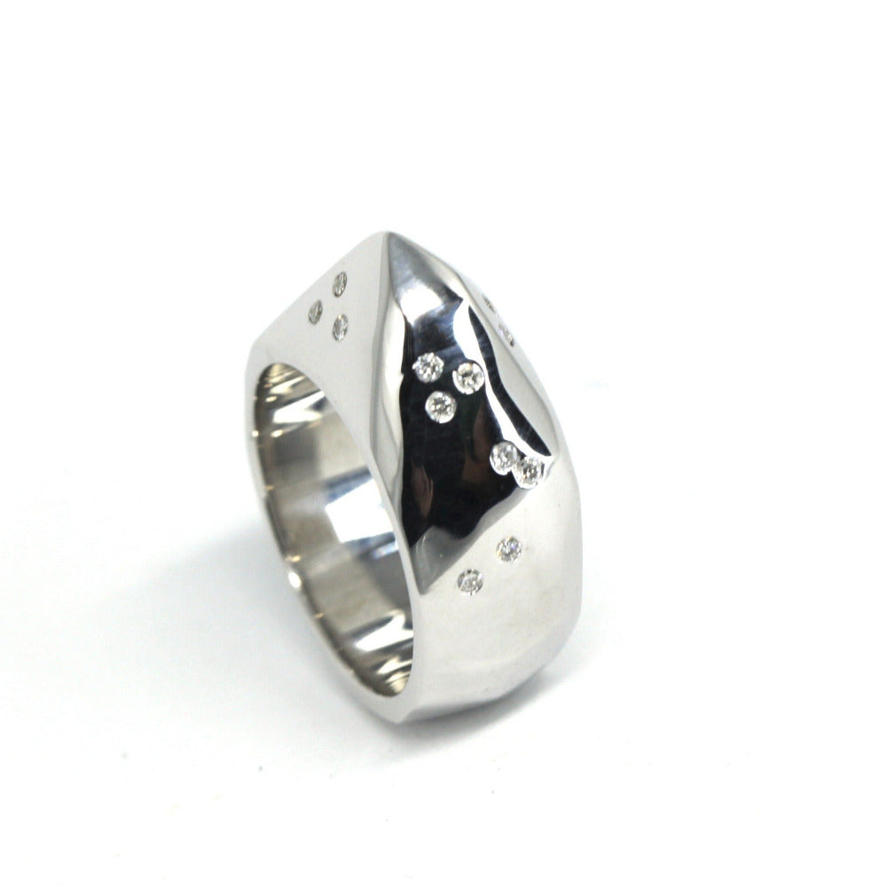 Close-up of Alp ring – Raw yet refined, this silver ring features unique diamond placements for an organic, edgy look.