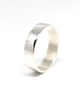front view of white gold men wedding band flat style and bright finish custom made bridal bena jewelry montreal on white background